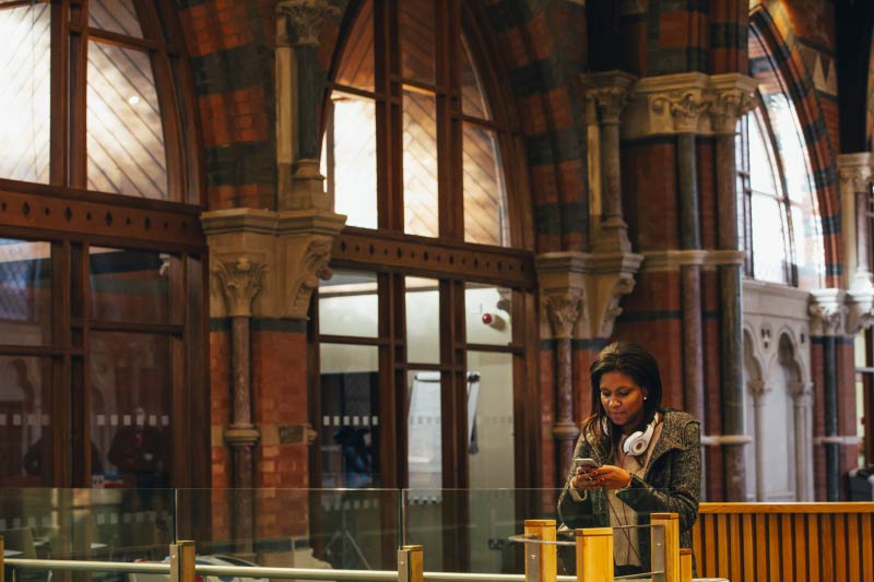 female student in the graduate school walking towards camera